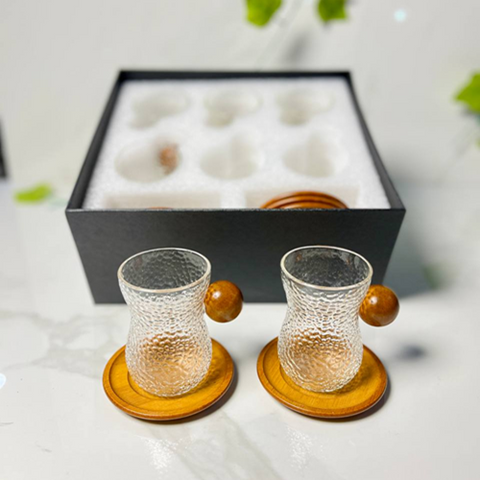 Image of طقم فناجين بيد خشب 12 قطعة بالكوستر