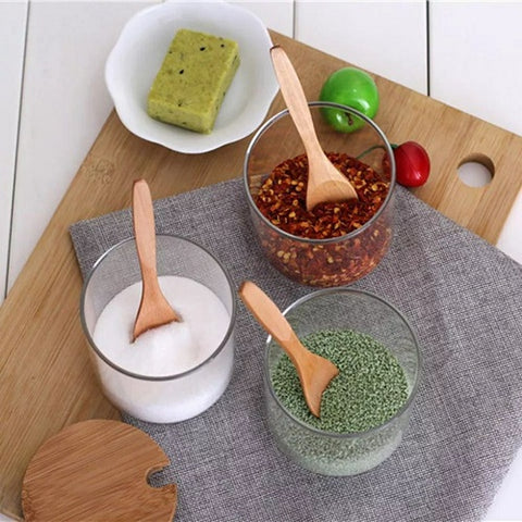 Image of طقم توابل زجاج بقاعدة خشبية