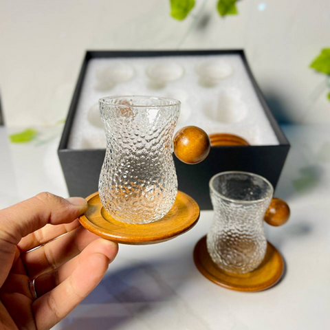 Image of طقم فناجين بيد خشب 12 قطعة بالكوستر